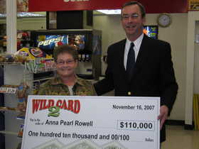 Anna Pearl Rowell receives her $110,000 winning Wild Card check Friday morning from Idaho Lottery Director Jeff Anderson.