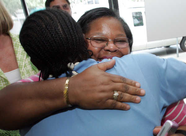 Edna Delbridge and Rodney Jackson, family members of Solomon Jackson, embrace as they arrive at the South Carolina Education Lottery Claims Center, Tuesday, August 25, 2009. Solomon Jackson, A retired South Carolina state employee who spent two bucks on the lottery last week is the winner of a $260 million Powerball jackpot.