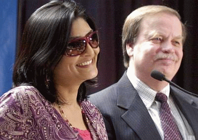The winner of an $81 million lottery prize picks up her check Wednesday with her lawyer, Terry Zimmer.