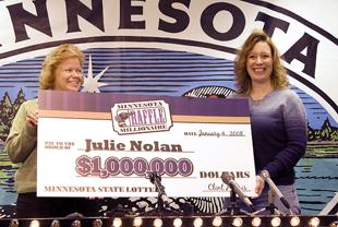 Julie Nolan, right, of Kellogg, Minn., and her mother Diane Wendt, hold Nolan's cardboard check in January of 2008 after she won a million dollars in the Minnesota State Lottery.