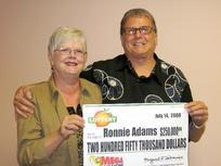 Ronnie Adams, 63, (shown here with his wife, Barbara) matched the first five numbers in the Mega Millions drawing, walking away with $250,000 in winnings.
